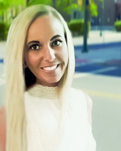 A woman with long blonde hair smiling for the camera.