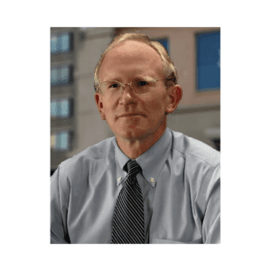 A man in a blue shirt and tie.